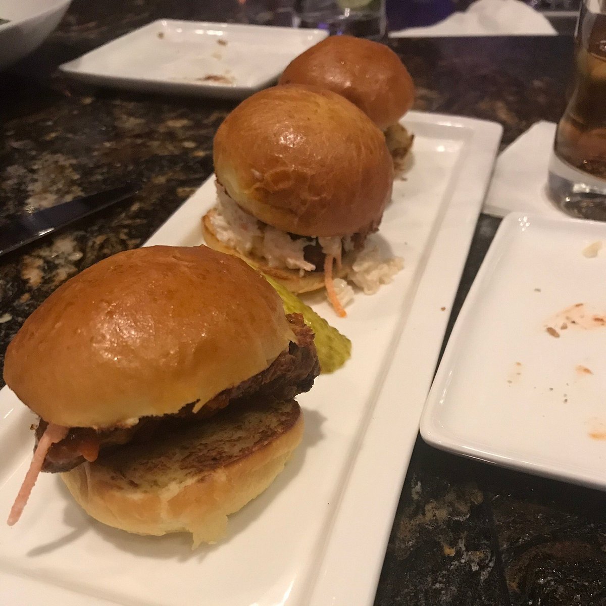 The Dime signature dishes The Dime Burger, Seared Scallops, Braised Short Rib, Charcuterie Board